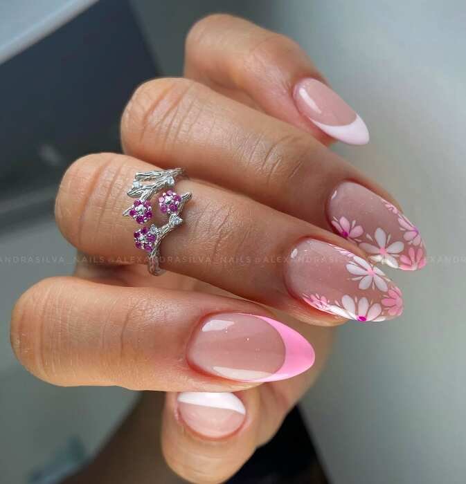 pink french tips and floral design on oval nails