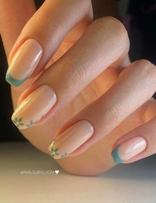 teal french tip nail design and modern flowers 