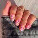 short square nails with white base orange and hot pink floral design