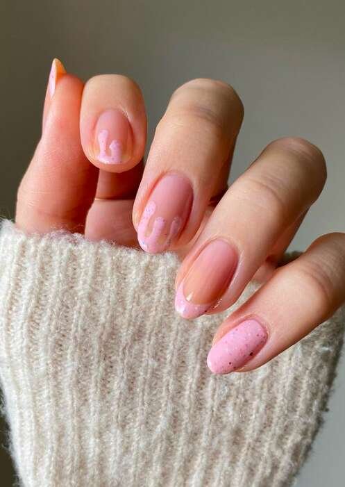 simple light pink strawberry frosting nail design on short oval nails.