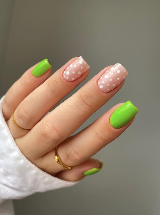 short square nails with white dots and neon green art