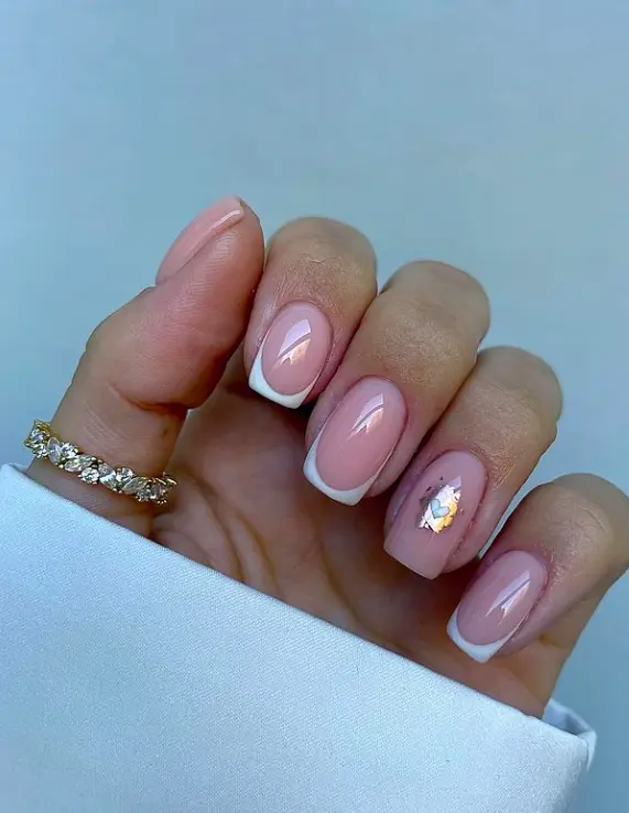french tip design with tiny heart on ring finger on short square nails