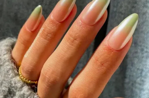 long oval nails with chrome green ombré design
