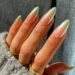 long oval nails with chrome green ombré design