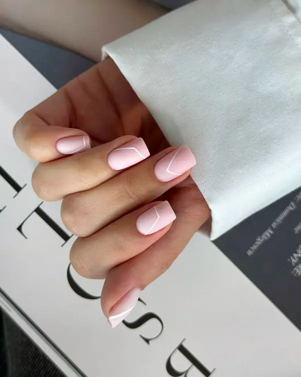 short square nails with matte white lines and nude base