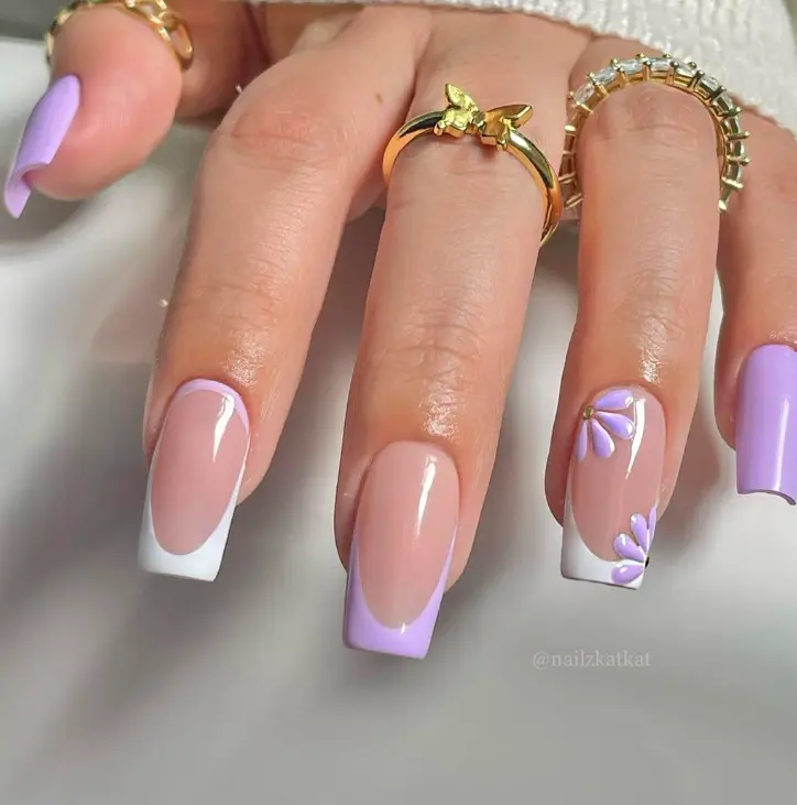 long square nails with white and purple french tips and flower design