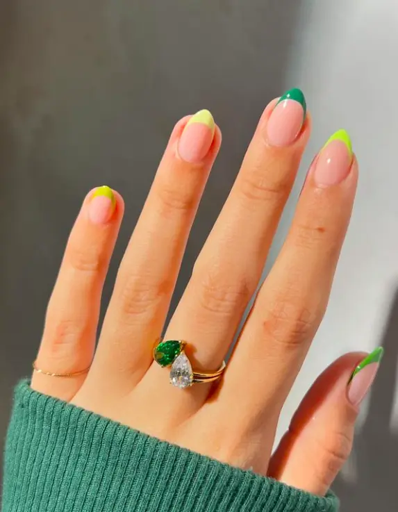 bright green french tips design on short almond nails