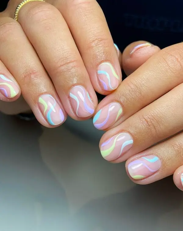 short oval nails with pastel swirls design