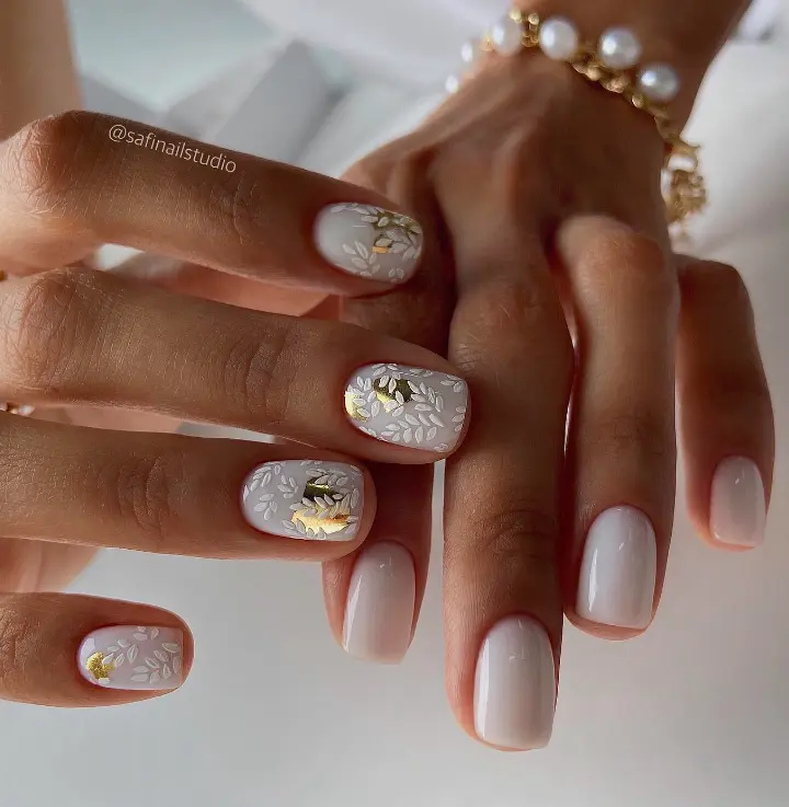 white and gold botanical nail art