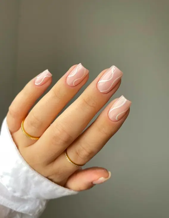 short square nails with white swirls design